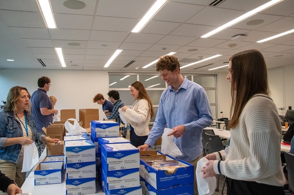 Summer interns pack dental kits for Mission Outpost community dental clinic