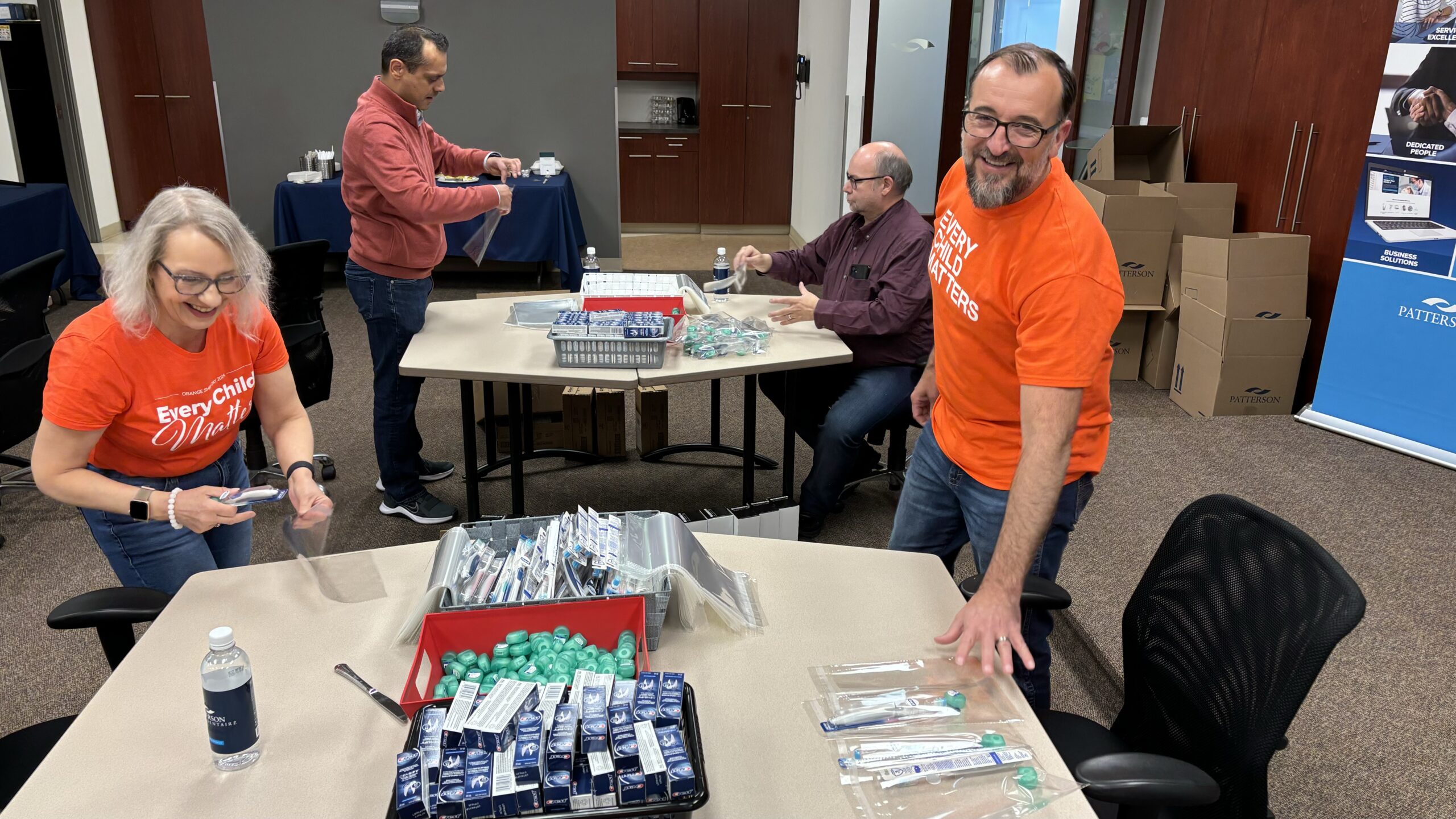 Two Patterson Companies team members volunteer for Orange Shirt Day