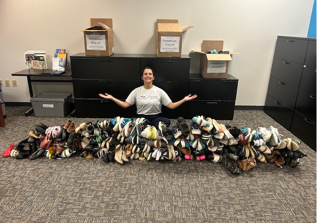 Volunteer pictured with shoe collection for Soles4Souls in Nashville