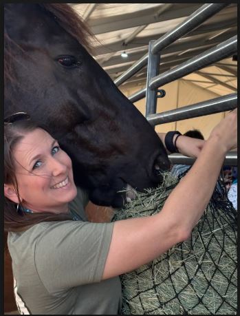 Volunteer with horse at San Antonio Rodeo